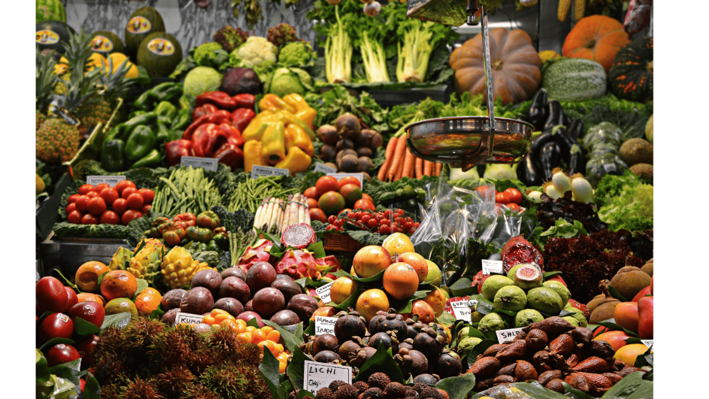 assorted fruits and vegetables at a market place to use as one of the life-changing weight loss tips